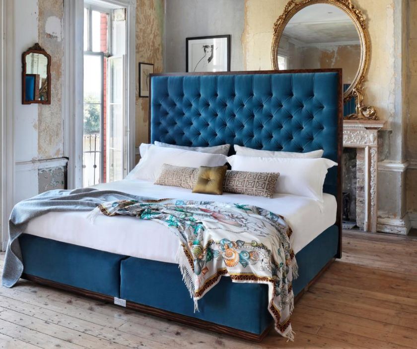Our State bed a fully upholstered blue headboard and base