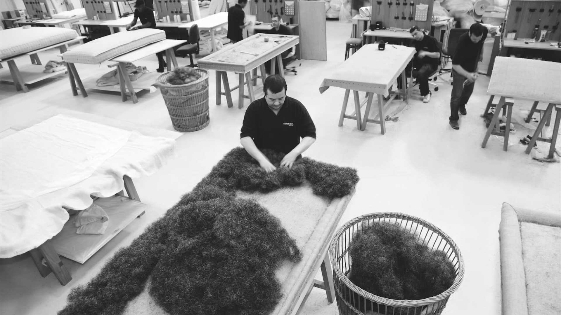 Savoir Beds bedworks in West London showcasing craftspeople at work